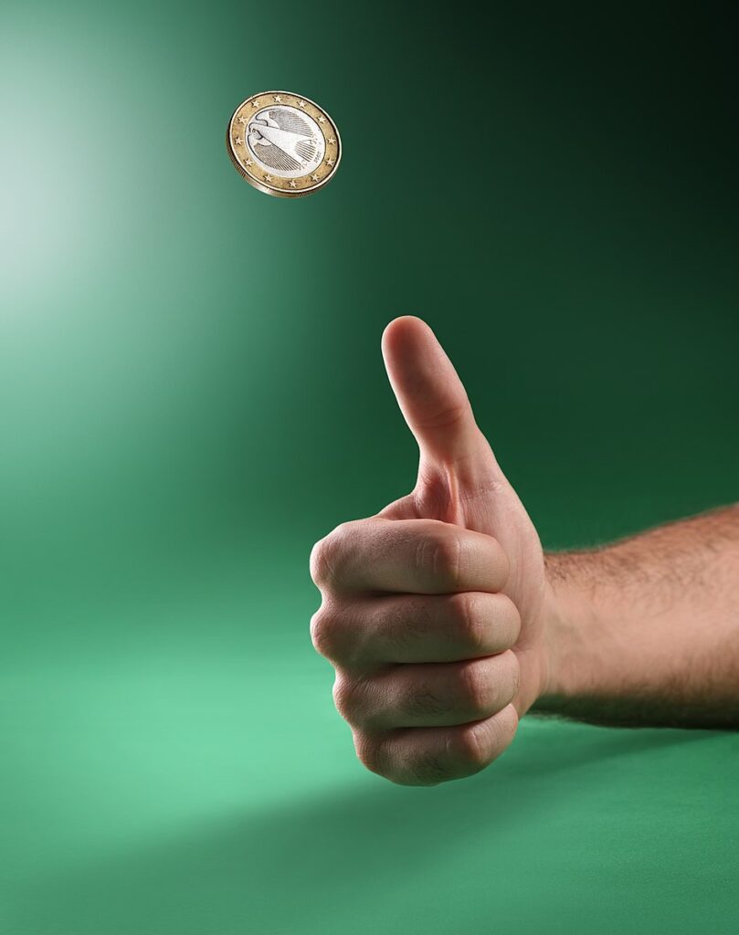 A coin spinning in the air during a toss